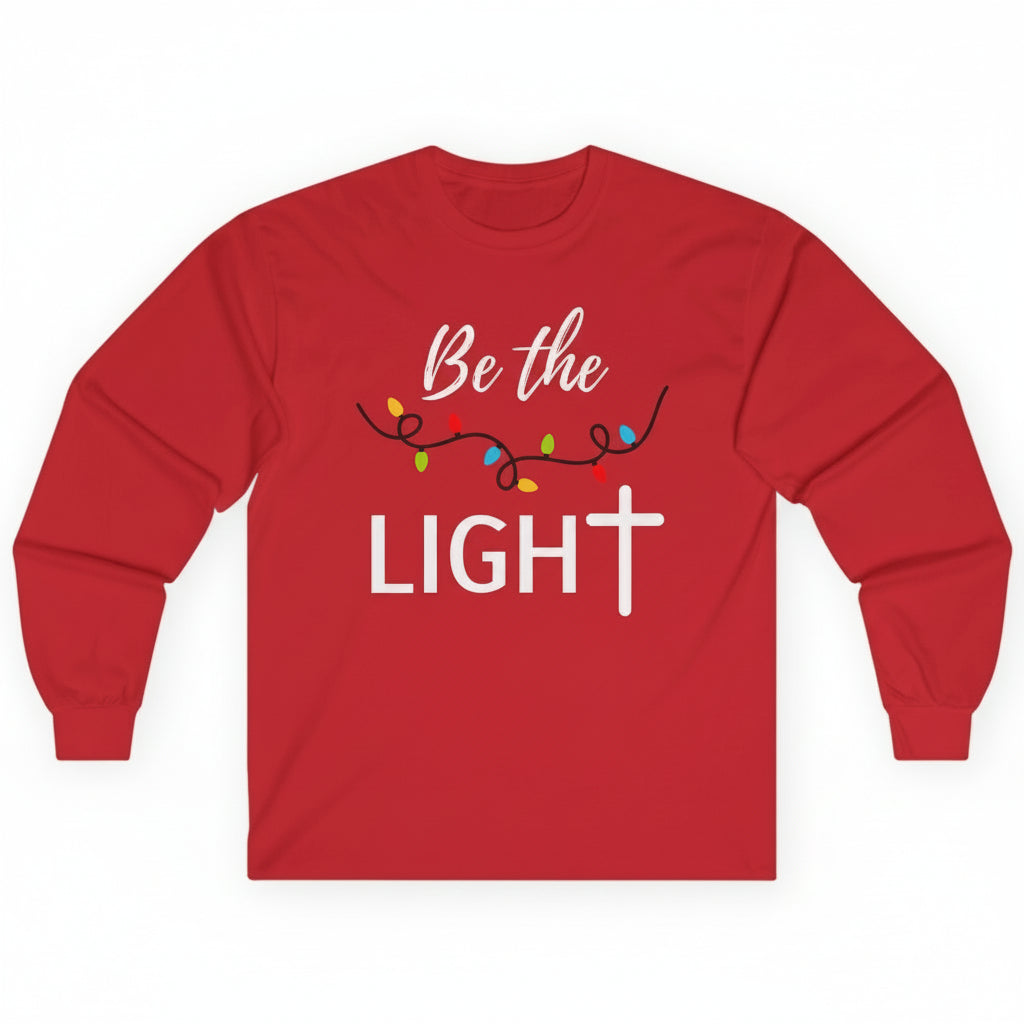 Front view of Be the Light Christian t-shirt with Christmas lights design — faith-based holiday shirt inspired by perfect Christmas Christ gift.